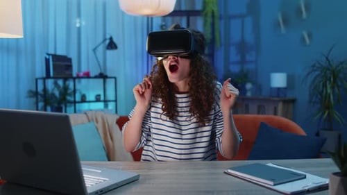 Woman Uses VR Headset in Dark Room