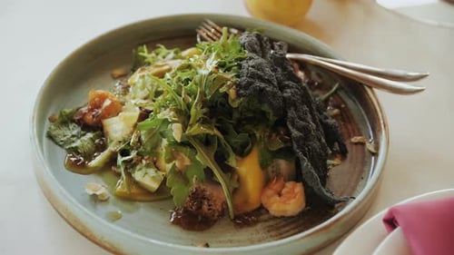 Plate of Food with Fork Featuring a Variety of Fresh Plantbased Ingredients