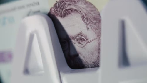 Close Up of Money Counting Machine Counting Thousand Hryvnia Banknotes