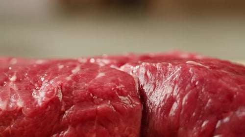 Man Chef Cooking Beef Steak Angus Closeup Professional Cheif Preparing Meat in Restaurant Kitchen