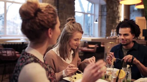 Friends Having Lunch Together at Restaurant
