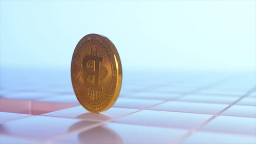 Physical Gold Bitcoin Coin Spinning on a Tiled Surface Representing Cryptocurrency Markets Digital