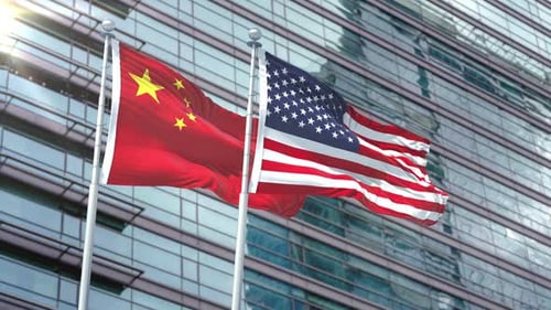 Flags of China and USA Waving in Modern Setting