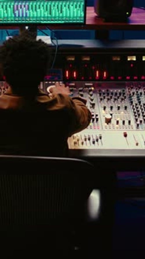 Vertical Video African American Sound Engineer Recording and Editing Tracks in Post Production