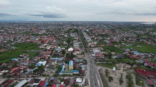 Aerial View of Dense Cityscape on Cloudy Day