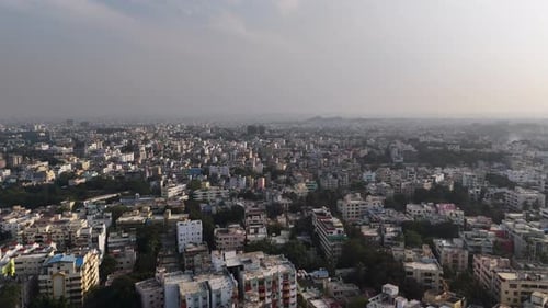 Cinematic aerial panorama of Hyderabad showcasing an endless urban sprawl, dense residential