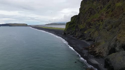 Reynisfjara Black Sand Beach in Beautiful Iceland Landscape, Aerial Drone Flight