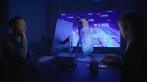 Business People Working on Computers at Night