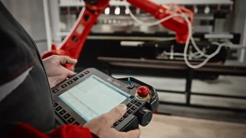 Operator Manages Bending Machine Functions Hands Operate Touchscreen And Joystick Controls