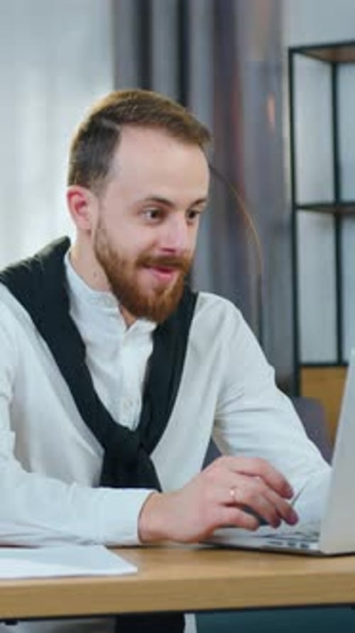 Overjoyed Man Office Manager Getting Good News on Computer About Confirmation of Investment