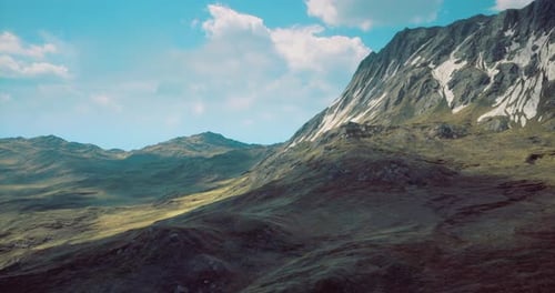 Majestic Mountain Landscape with Lush Green Valleys and Clear Blue Skies