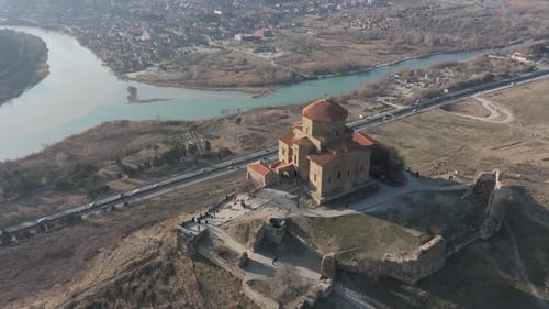 Aerial Drone fly Jvari Monastery above River Confluence in Mtskheta, Georgia Historic Landmark