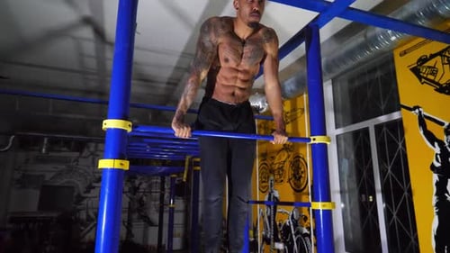 Strong African Sportsman Doing Exercises on Horizontal Bar at Modern Gym Muscular Afro American Man