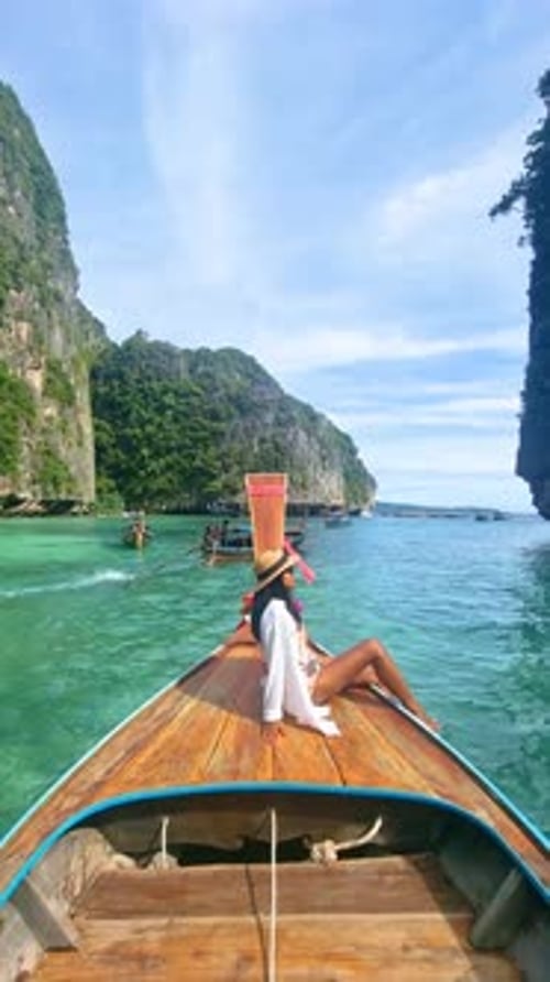 Pileh Lagoon with Green Emerald Ocean at Koh Phi Phi Thailand Women in Front of Longtail Boat