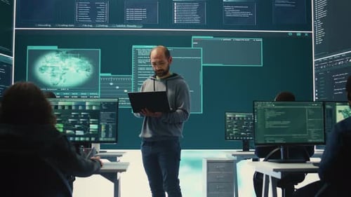 Team of Programmers Analyzing Data in Modern Office