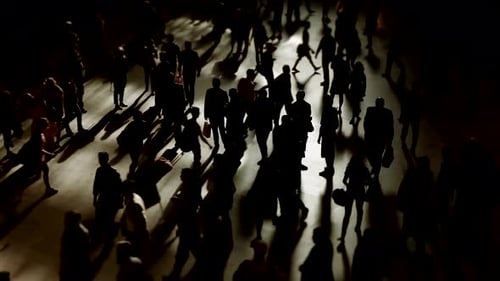 establishing shot of rush hour commuters walking in the city