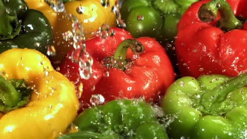 Washing Colorful Bell Peppers in Close-up Shot
