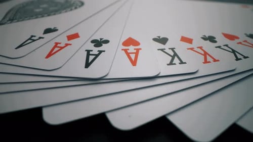 Playing Cards Beautifully Spread on a Dark Surface - Close-Up View