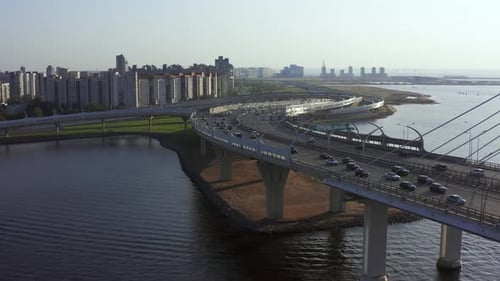 Departure past the automobile cable-stayed bridge passing through the river