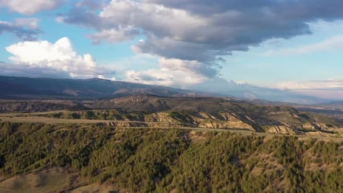 Aerial view trees, mountains and clouds 4K