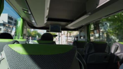 An InDepth Interior View of a Contemporary Bus Showcasing Beautiful Green Accents Bathed in Bright