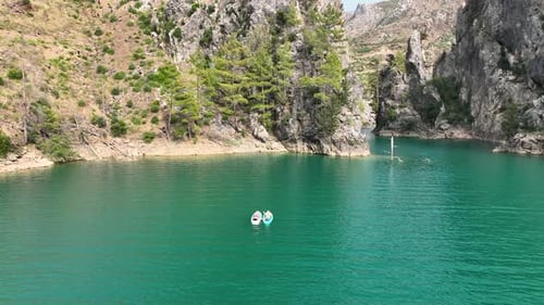 Aerial View Paddleboarding and Relaxing in the Green Canyon People Enjoying the Summer Sun