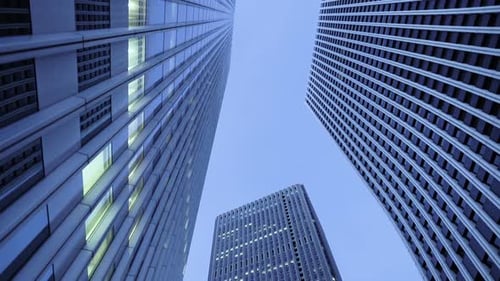 Low Angle Gliding Shot of Skyscrapers in the Tokyo. Financial District. Skyscape and Cityscape in t