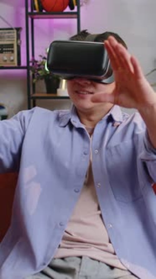 Man Experiencing Virtual Reality in Cozy Home