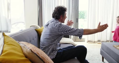 Father and Daughter Playing Together at Home