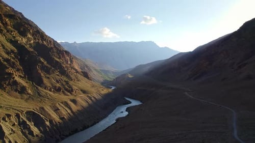 Alpine mountains near a narrow mountain river.