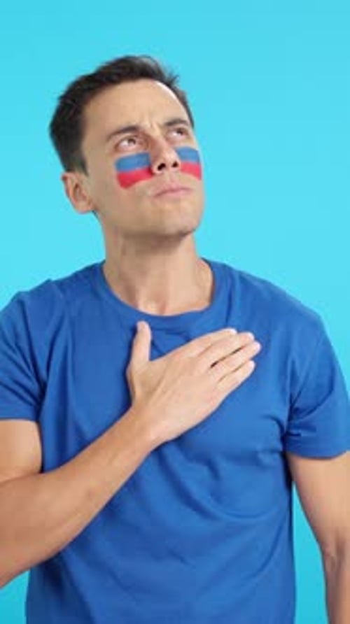 Man Listening to the Haiti National Anthem with Solemnity