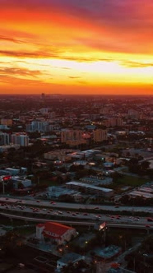 Stunning orange and yellow sky above the panorama of Miami, Florida, USA.