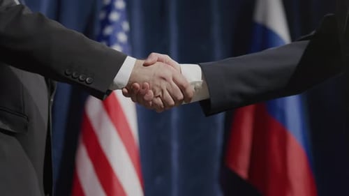 Close-Up of Handshake between Diplomats at International Political Event