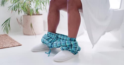 Bathroom, feet and phone on toilet in the morning with a person in a home