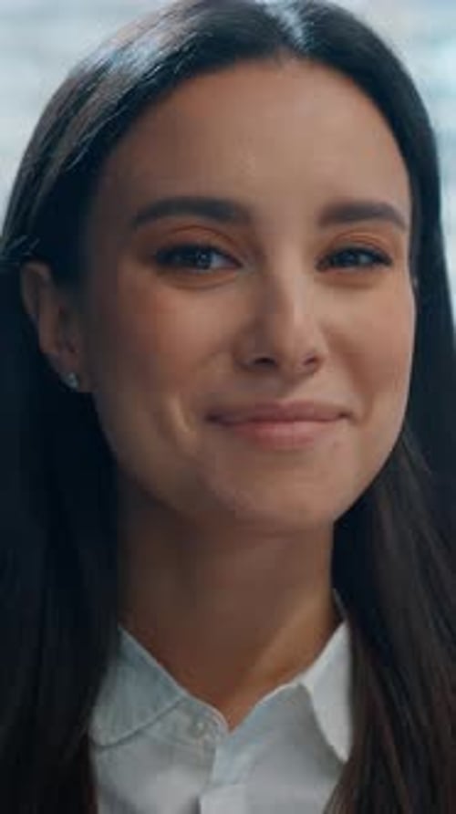 Smiling Young Woman in White Shirt Close Up