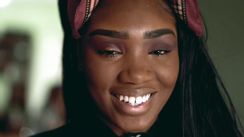 Joyful South American young black latina woman smiling at camera. Close-up face of 20s adult girl