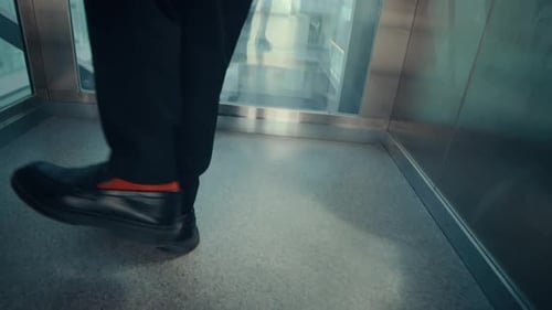 Businessman Dancing in Elevator