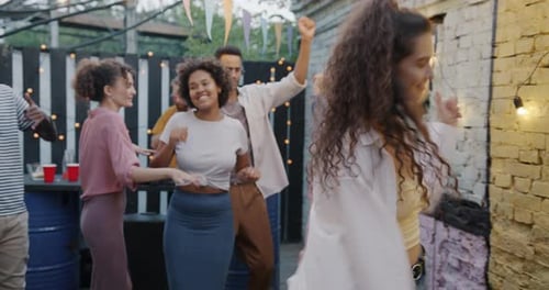 Joyful Young Woman in Stylish Outfit Dancing in Street Cafe Enjoying Music in Leisure Time