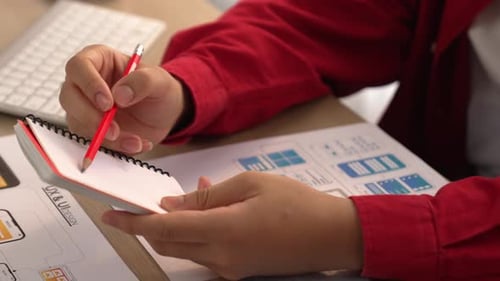 UX UI designer of startup company in workplace plan on user interface. Synergic