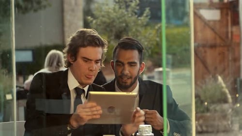 Young Multiracial Mobile Business Men Working on New Business Deal on Tablet