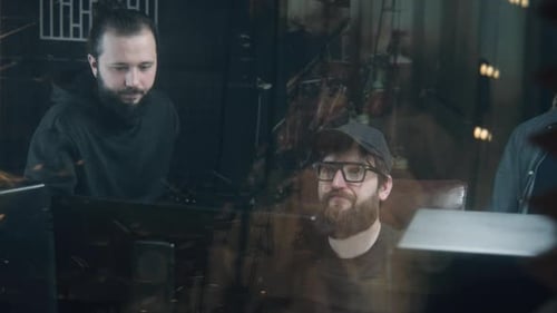 Young Adults Working in Music Recording Studio
