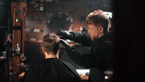Stylish Barber Giving Haircut in Modern Barbershop