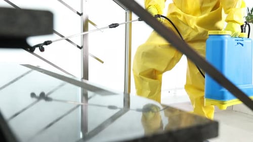 Cleaning Person Disinfecting Stairs Inside