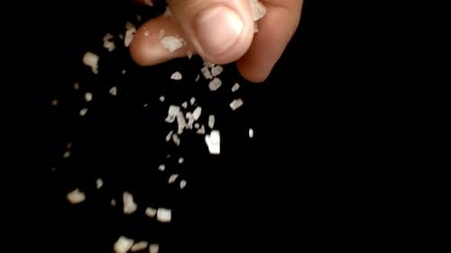 Coarse Salt Falling on Black Background, Detail
