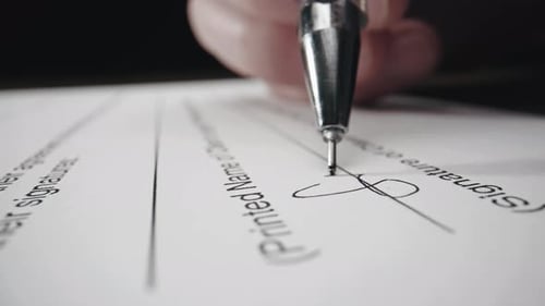 Close Up Signing Legal Document with Pen