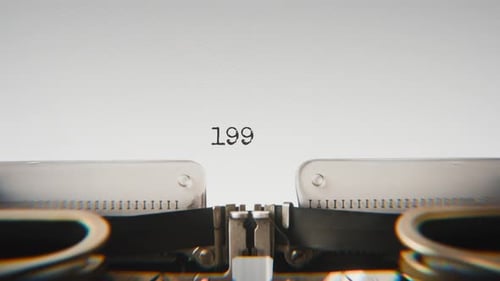 Old mechanical typewriter typing Year 1999 in a close-up view.