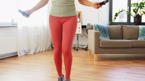 Woman Skipping Rope for Cardio Workout at Home
