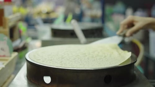 Preparing Crepe With Chocolate Hazelnut Spread Close Up