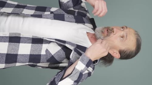 Man Fanning Shirt Collar for Air