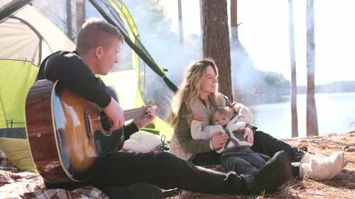 Family Camping Trip with Guitar by the Lake